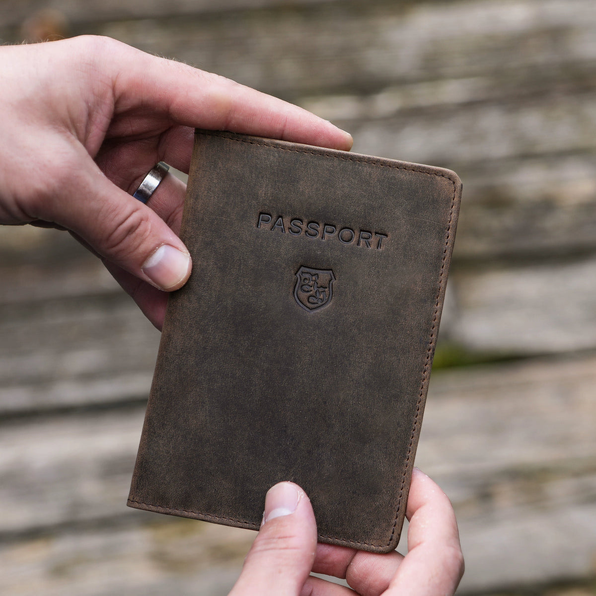 Leather travel wallet with compartments for passport and boarding pass